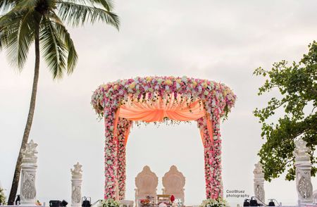 Floral mandap decor in pastel peach and pink
