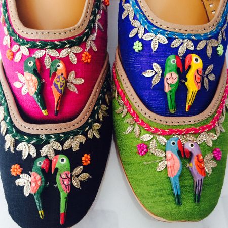 Photo of parrot detailing on flat shoes