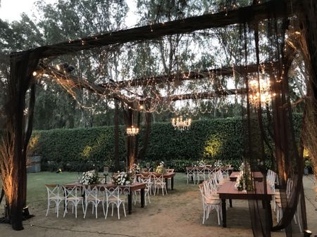 Beautiful dinner setup in a garden themed outdoor venue