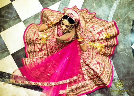 Twirling bride with flared out pink lehenga