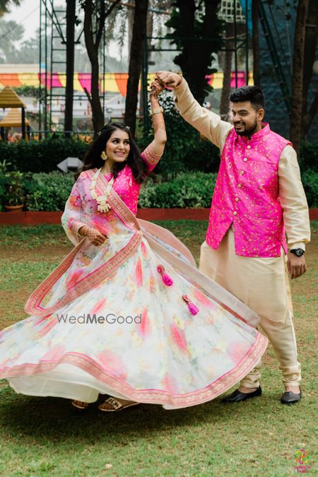 Twirling shot of the couple on mehendi 