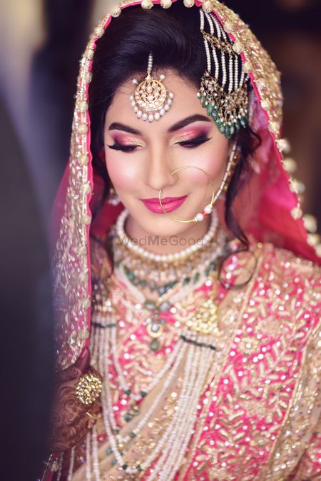 Photo of Muslim bridal look with pink smokey eyes