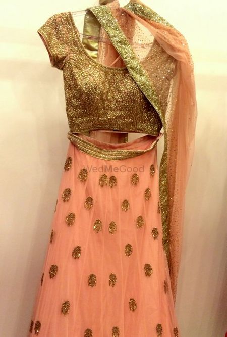 Photo of peach lehenga with delicate gold work