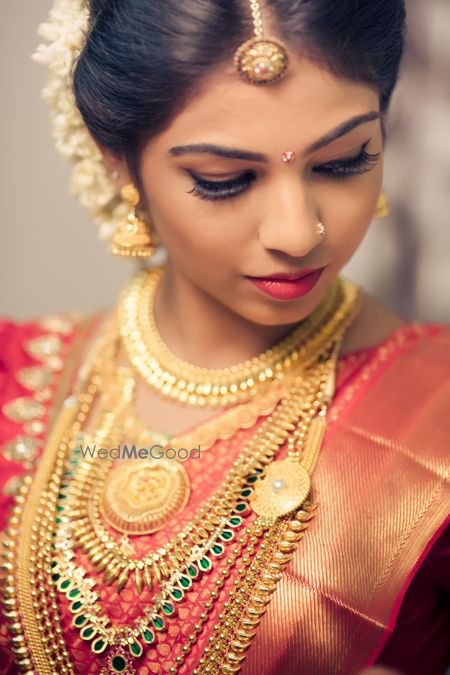 Photo of rust orange and red bridal kanjivaram