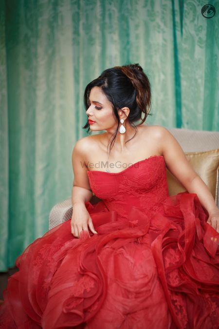 Bride in red strapless ruffled gown