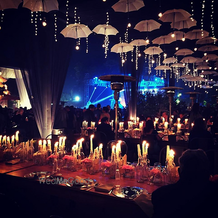 Reception umbrellas and candles lit decor