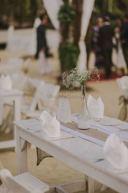 Photo of Beach cocktail with table setting simple centerpiece