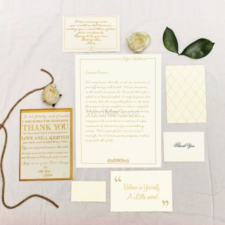Photo of White and Gold Wedding Invitation