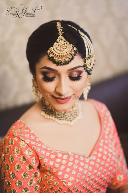 Photo of Bridal makeup look with gold smokey eyes
