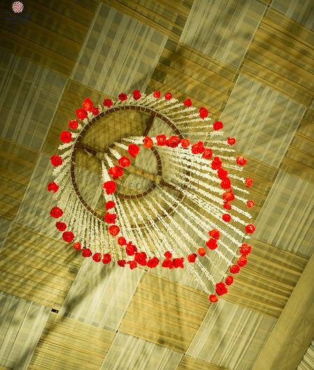 Photo of Mogra strings with red roses hanging in decor