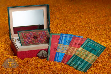Photo of Colourful ikat print wedding cards in box