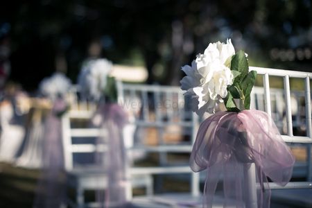 Photo of Chair decor idea with light pink cloth and white flower