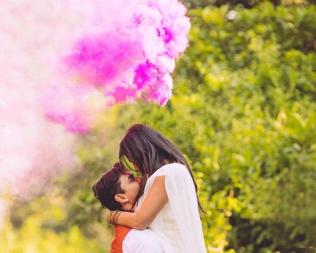 Pre wedding shoot with pink smoke bomb prop