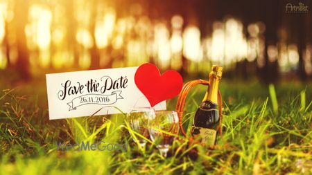 Save the date with champagne and a heart