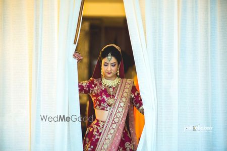 Photo of Bride looking at of window