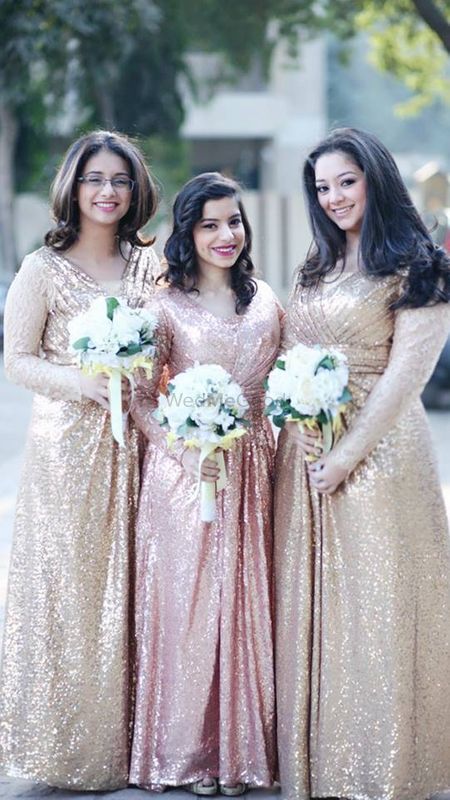 Photo of Bridesmaids in gold sequin gowns