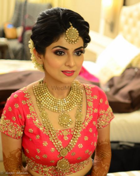 Gold finish jewellery bridal look with pink lehenga