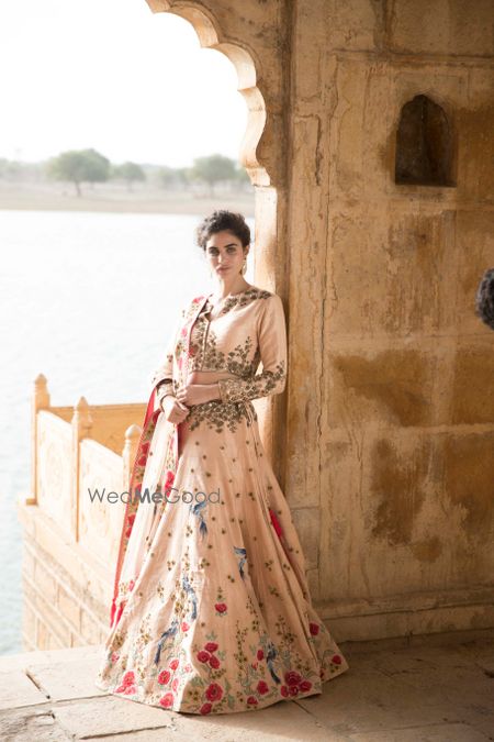 Blush pink lehenga with floral motifs and zardozi work