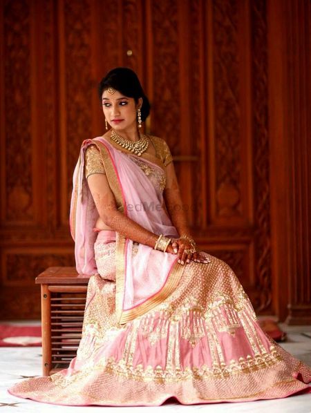 Photo of light pink and gold pastel sangeet or wedding lehenga for morning wedding