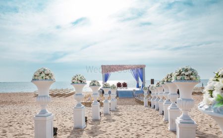 aisle decor with large flower vases and flowers inside
