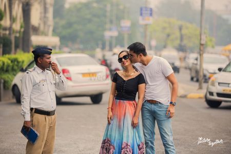 Cute pre wedding shoot pose with traffic cop