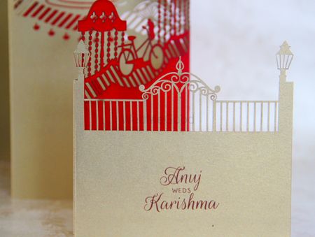 Red and gold laser cut layered wedding card with fort