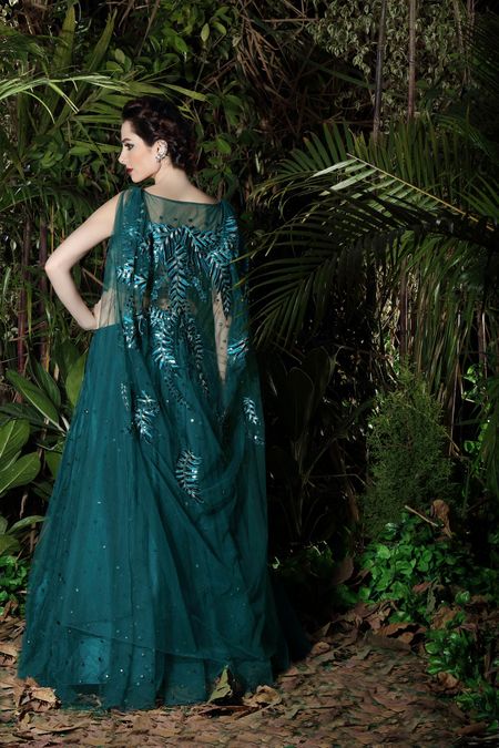 Teal evening gown with embroidered cape