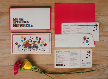 Red and white boarding pass wedding card