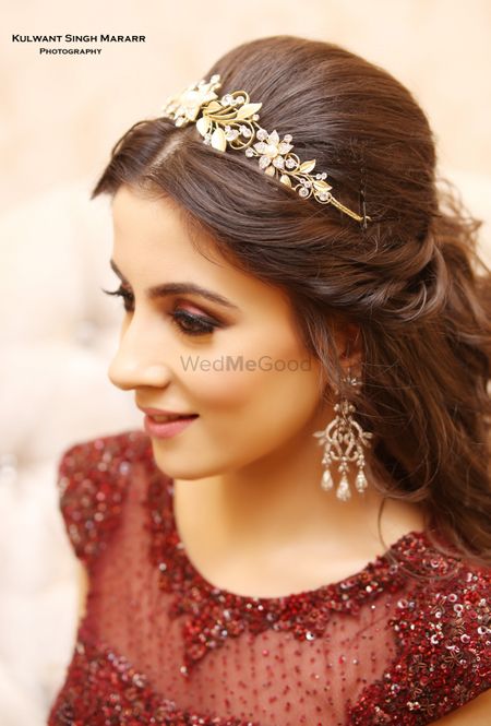 Bride wearing tiara style hair accessory with gown