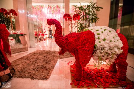 Photo of Red and white floral elephant decor