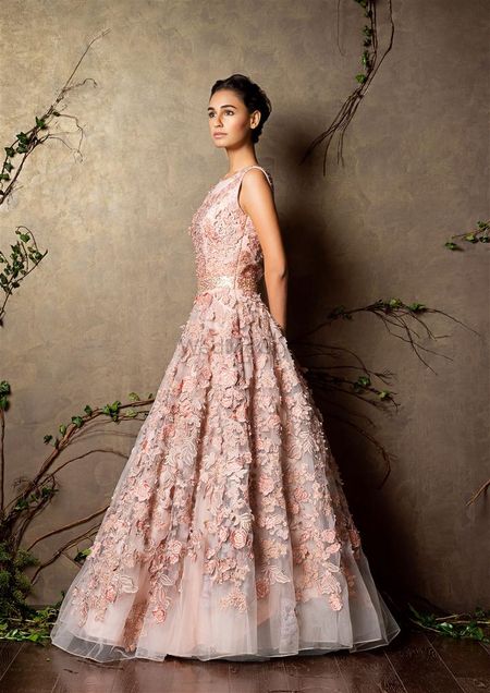 Photo of sleeveless light pink gown with flowers all over