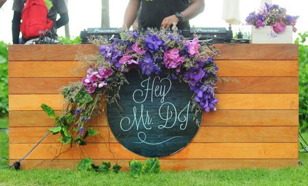 Photo of Cute decor idea for DJ station with flowers