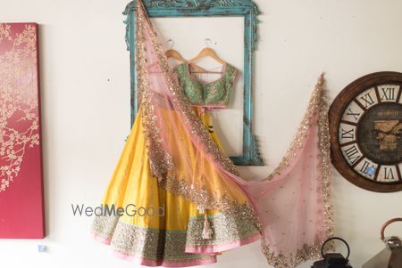 butter yellow lehenga with pink dupatta