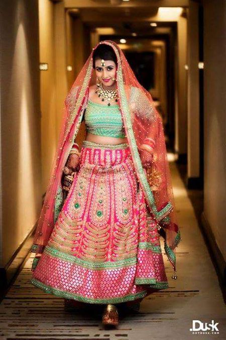 Offbeat bridal lehenga in pink with turquoise blouse