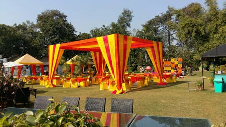 yellow and orange tents mehendi decor