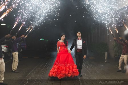 bride and groom engagement entry with sparklers