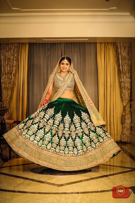 Twirling bride in shades of green