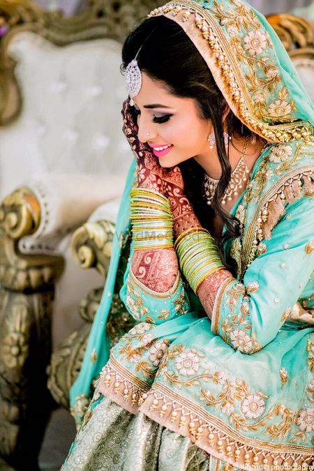 Turquoise and gold muslim inspired bridal lehenga