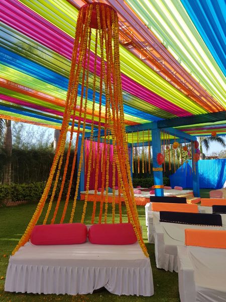 Photo of genda floral strings stage decor for mehendi