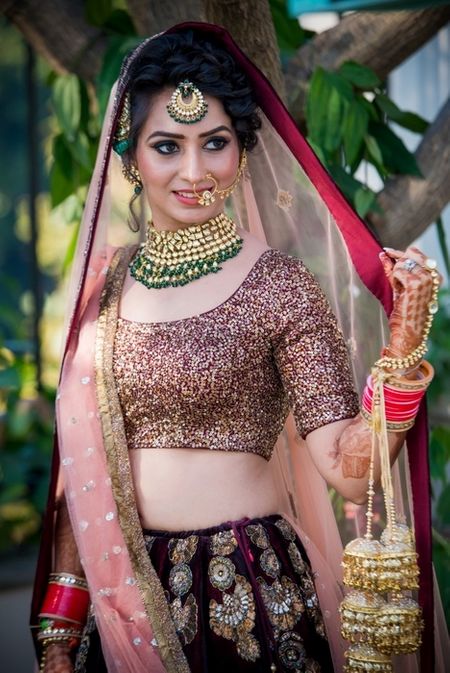 Offbeat plum and pink bridal lehenga with contrasting jewellery