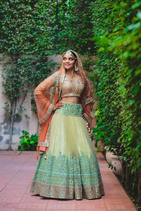 lime green and gold lehenga with coral dupatta