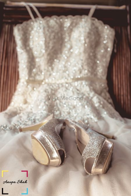 Photo of Christian wedding gown with silver bridal heels