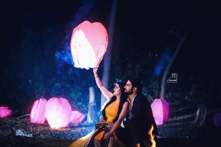 Couple releasing lantern pre wedding shoot prop