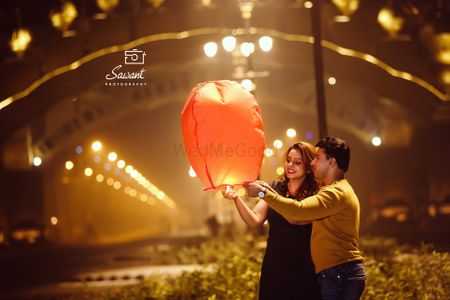 Couple releasing lantern on pre wedding shoot