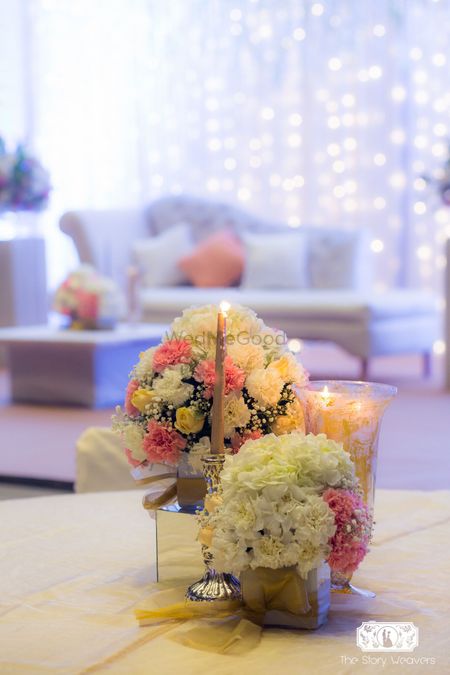 Floral centerpiece with flowers and candles