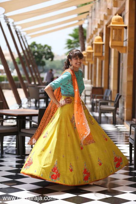 Turquoise and yellow lehenga for mehendi with high neck blouse