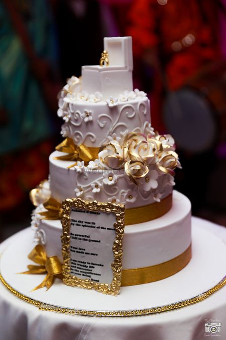 Photo of white and gold cake