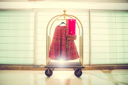 Lehenga on hanger at hotel trolley