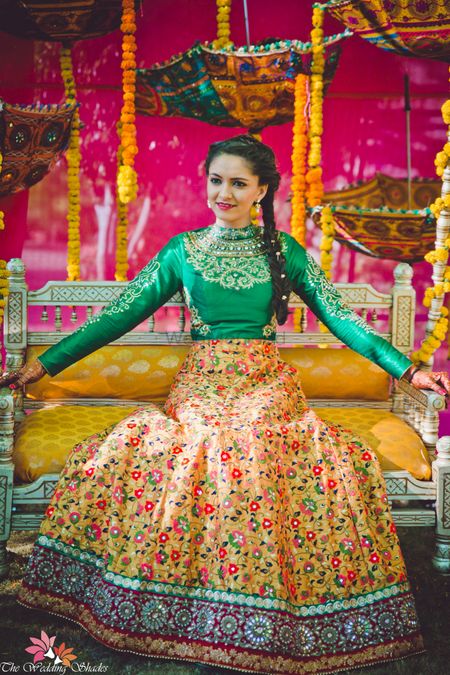 Photo of Yellow and green lehenga for mehendi with full sleeved blouse