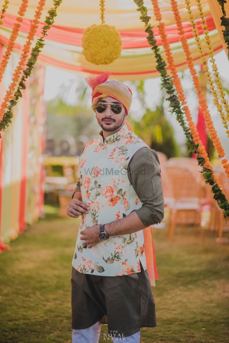 Photo of Mehendi groomwear with white and peach floral print nehru jacket